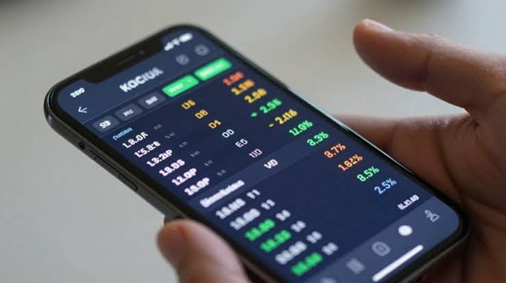 Forex Trading App on Phone Hand